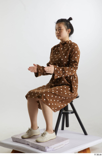 Aera  1 brown dots dress casual dressed sitting white…